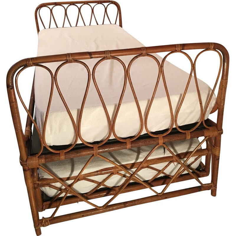 Vintage nesting bed in rattan