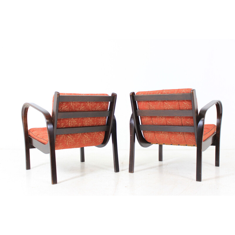 Set of 2 vintage red armchairs by Kozelka and Kropáček