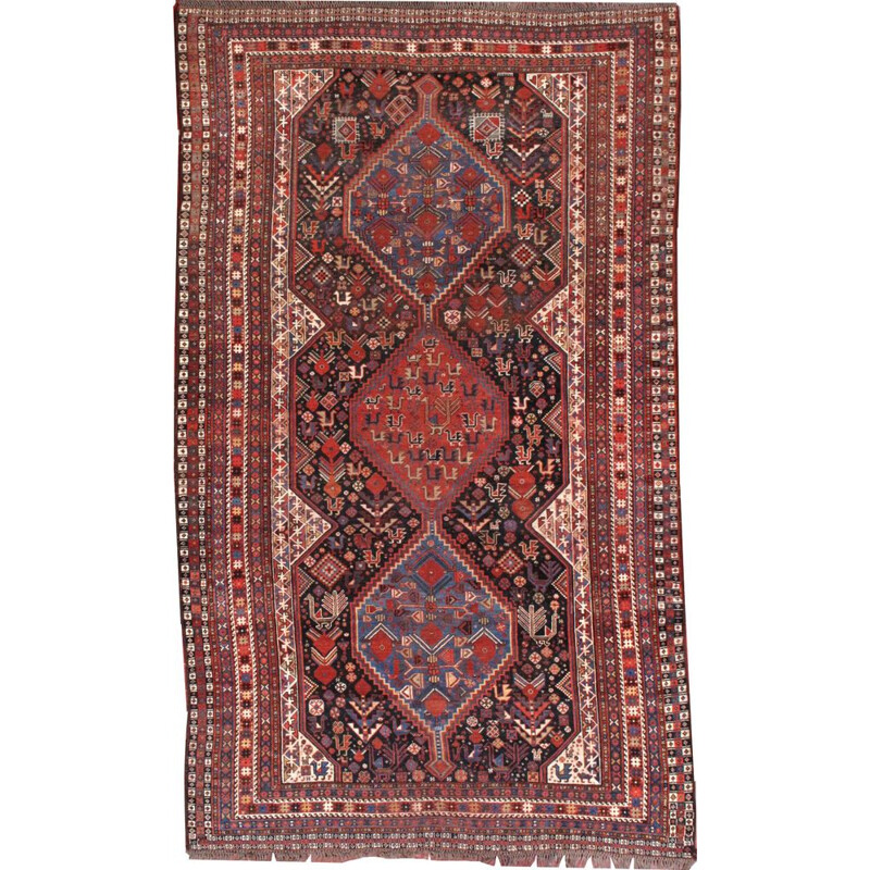 Tapis vintage perse Khamseh fabrication artisanale en laine rouge 1930 