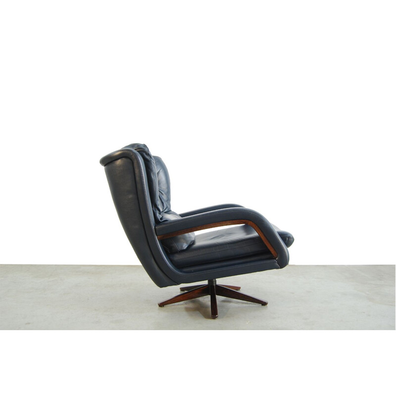 Fauteuil vintage pivotant en cuir