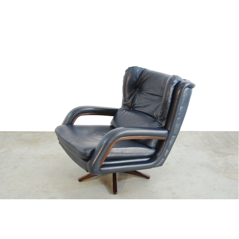 Vintage leather swivel armchair