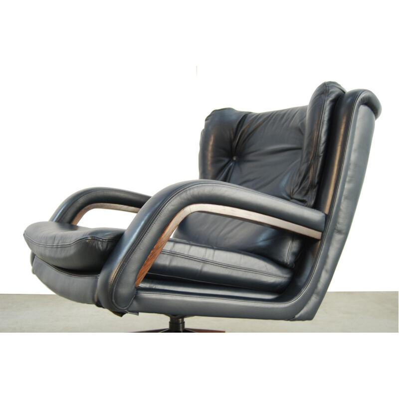 Vintage leather swivel armchair