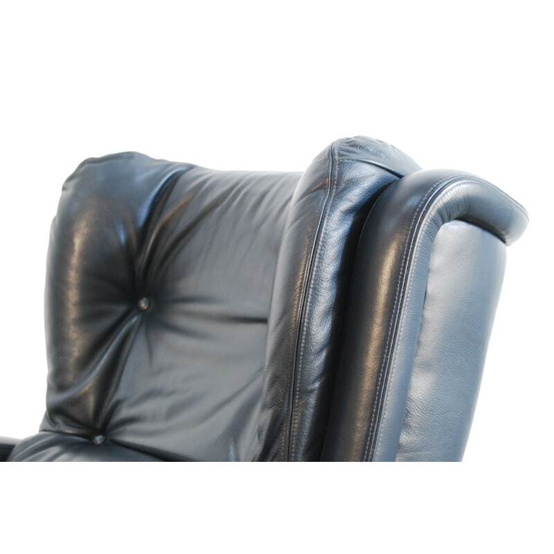 Vintage leather swivel armchair