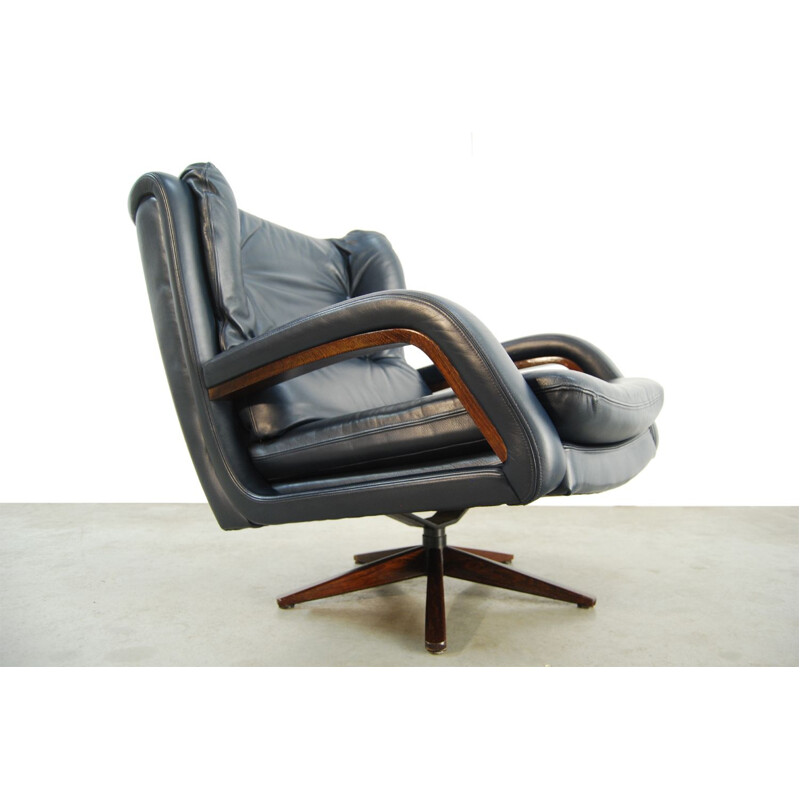 Vintage leather swivel armchair