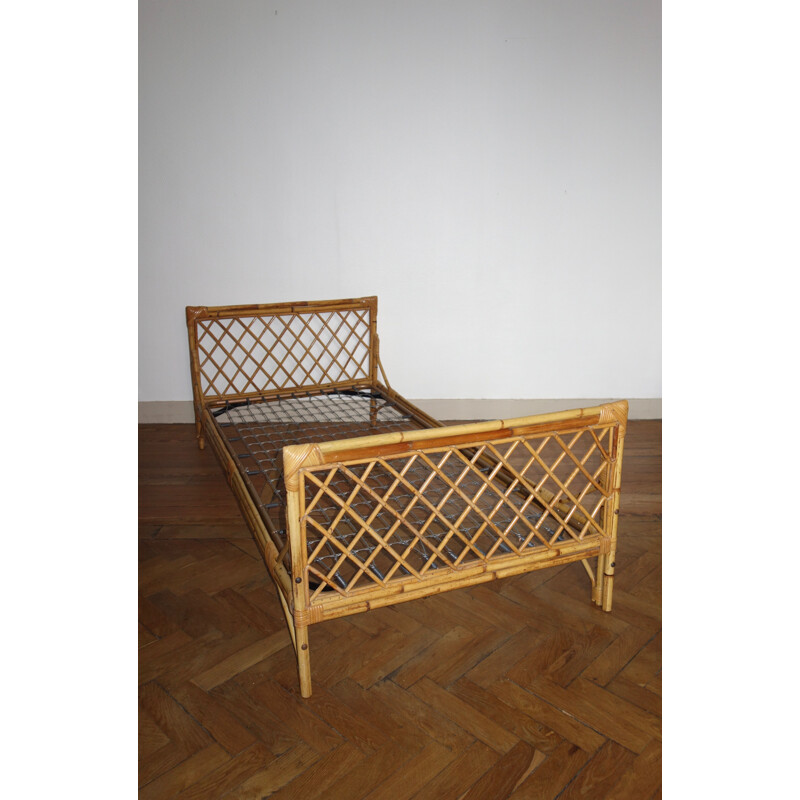 Vintage French bed in rattan