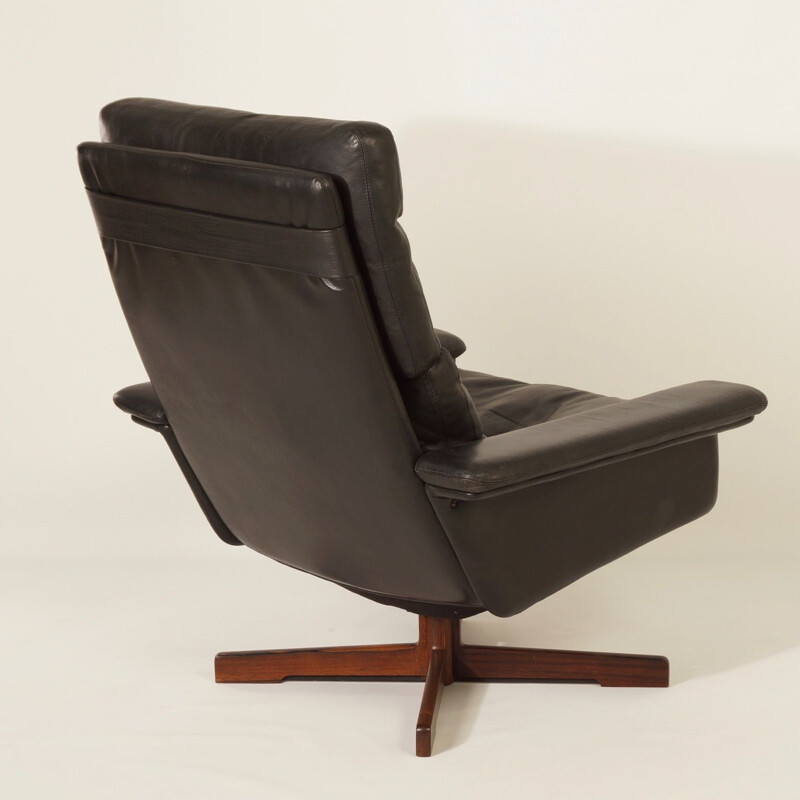 Vintage Danish swivel armchair in black leather