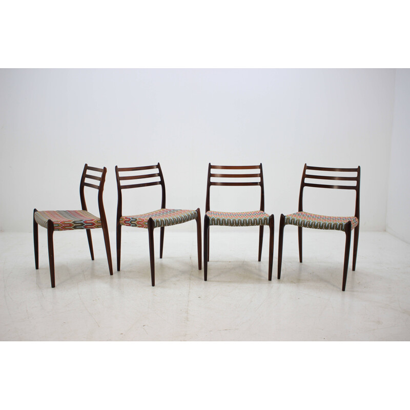 4 vintage Danish dining chairs in rosewood and multicolored fabric by N. O. Møller