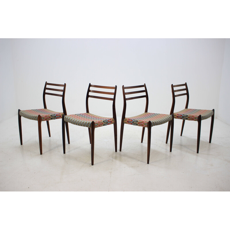 4 vintage Danish dining chairs in rosewood and multicolored fabric by N. O. Møller
