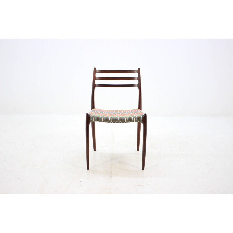 4 vintage Danish dining chairs in rosewood and multicolored fabric by N. O. Møller