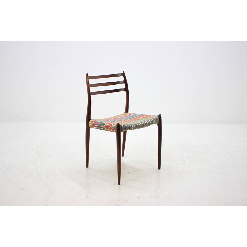 4 vintage Danish dining chairs in rosewood and multicolored fabric by N. O. Møller