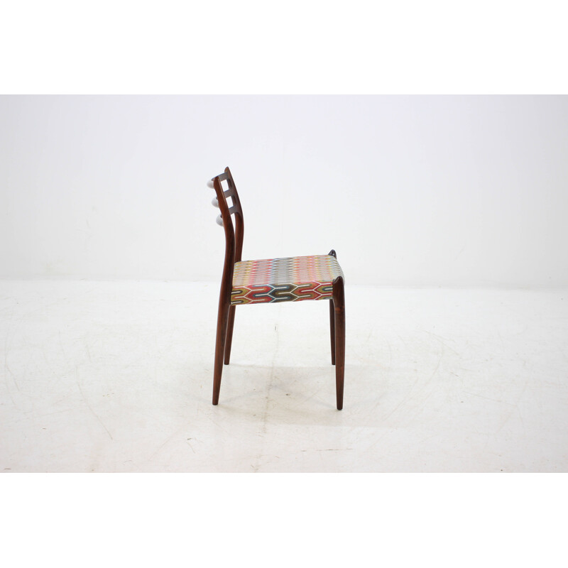 4 vintage Danish dining chairs in rosewood and multicolored fabric by N. O. Møller