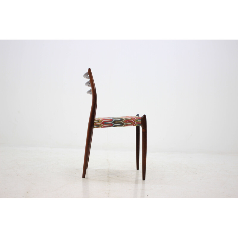 4 vintage Danish dining chairs in rosewood and multicolored fabric by N. O. Møller