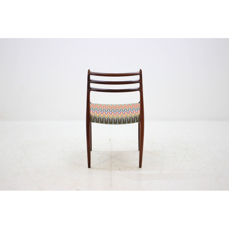 4 vintage Danish dining chairs in rosewood and multicolored fabric by N. O. Møller