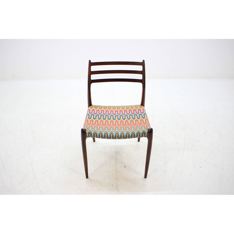 4 vintage Danish dining chairs in rosewood and multicolored fabric by N. O. Møller