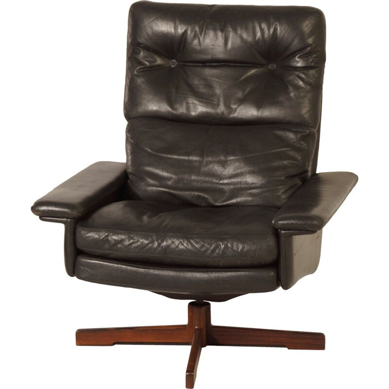 Fauteuil vintage pivotant en cuir noir