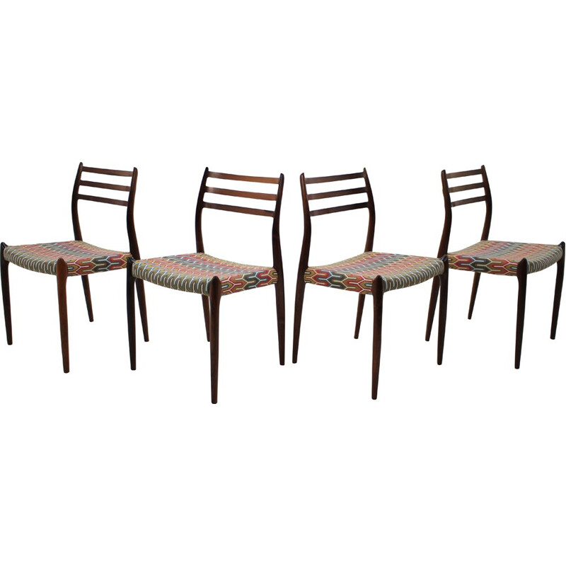 4 vintage Danish dining chairs in rosewood and multicolored fabric by N. O. Møller