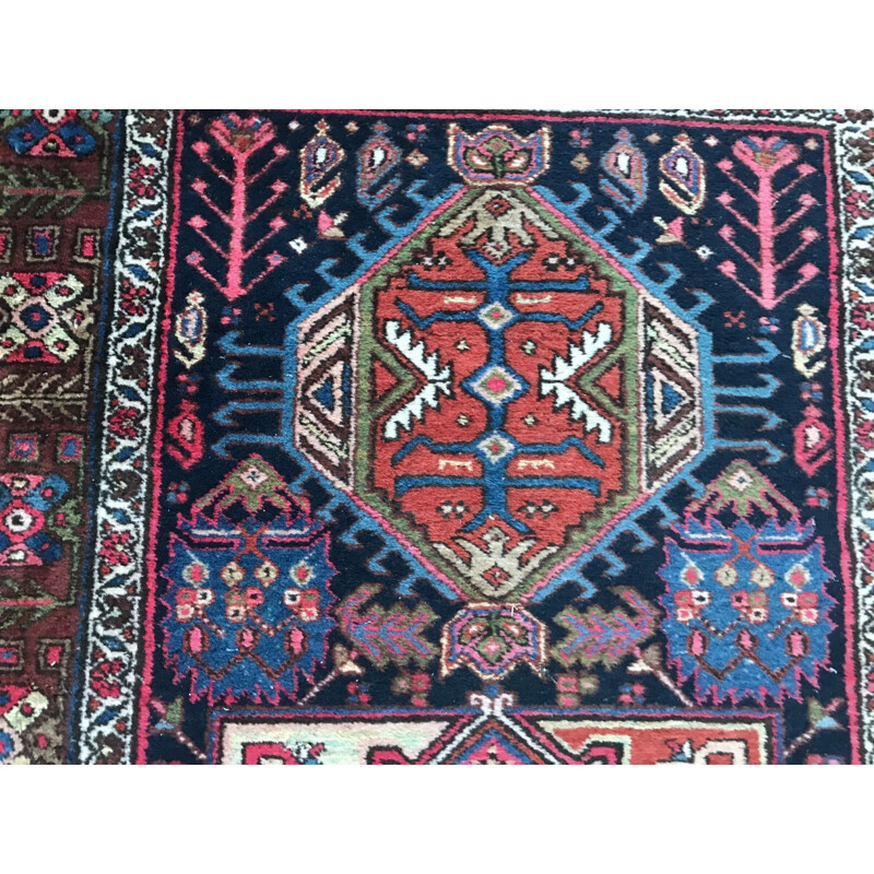 Vintage Persian carpet made of wool