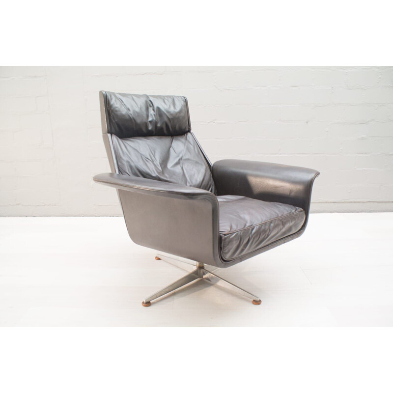 Vintage German swivel armchair in leather by Hans Kaufeld