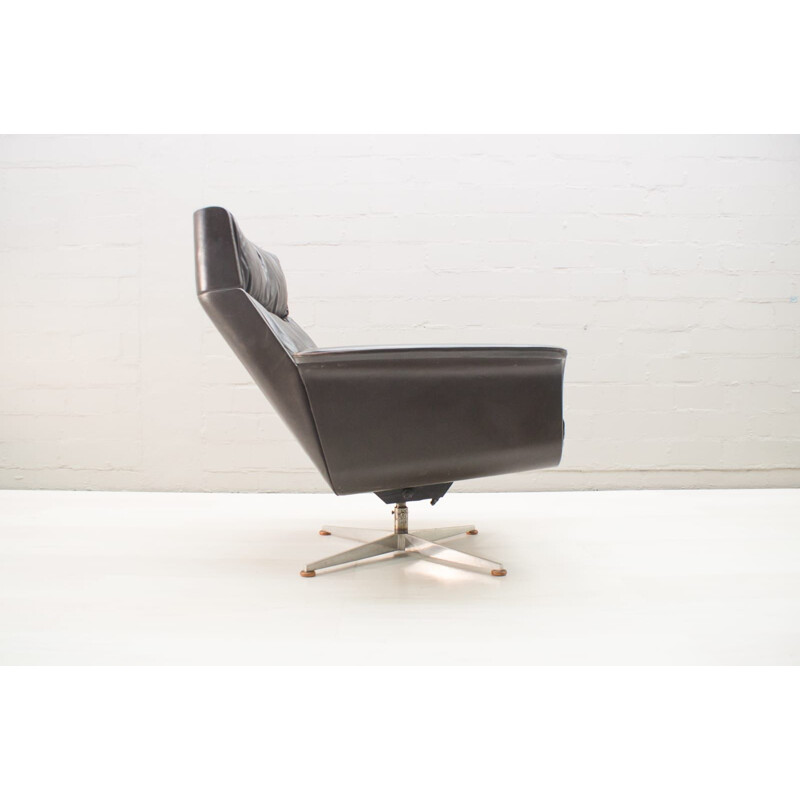 Vintage German swivel armchair in leather by Hans Kaufeld