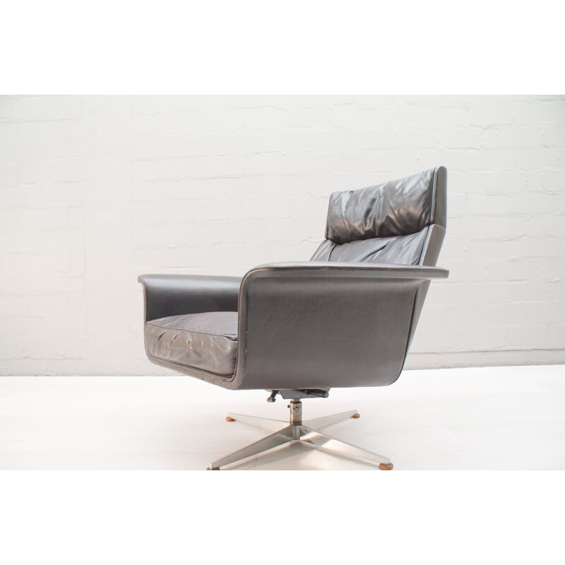 Vintage German swivel armchair in leather by Hans Kaufeld