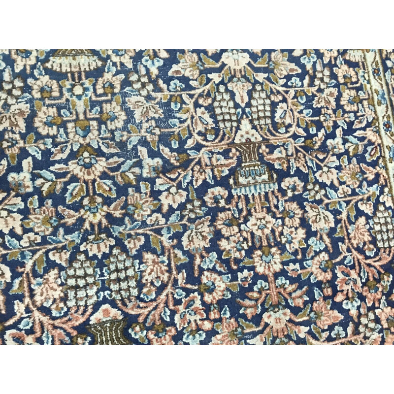 Vintage blue Persian carpet in cotton