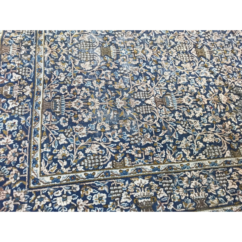 Vintage blue Persian carpet in cotton