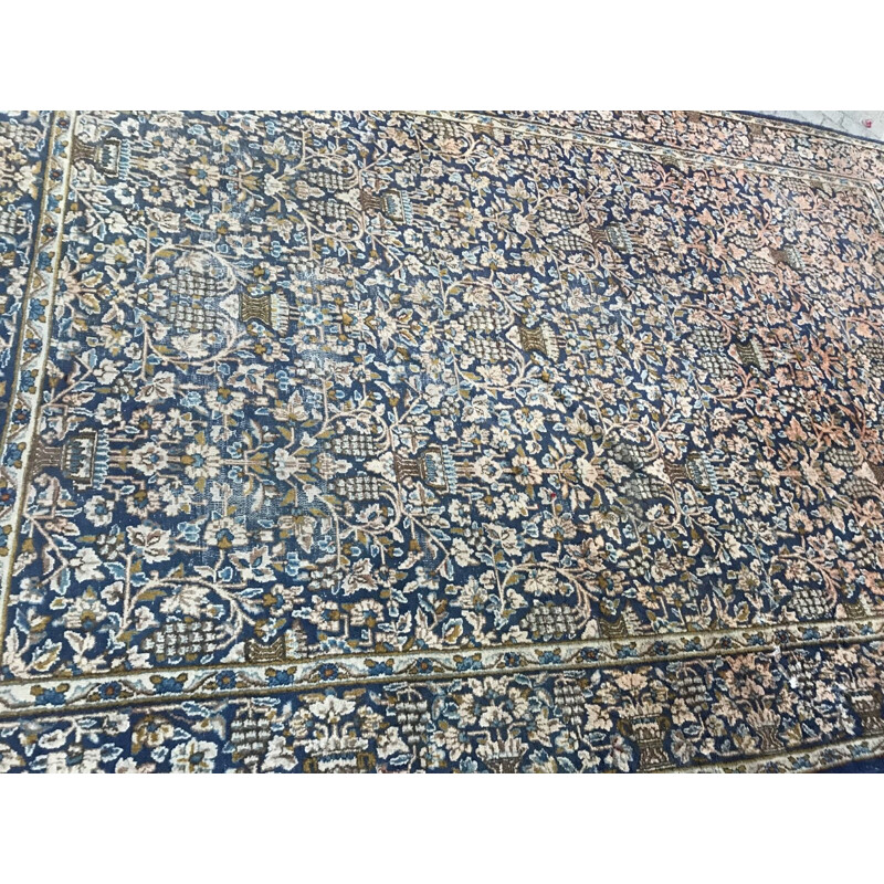 Vintage blue Persian carpet in cotton