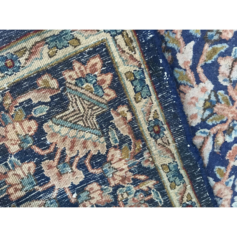 Vintage blue Persian carpet in cotton