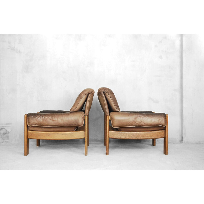 Set of 2 vintage Danish armchairs in leather