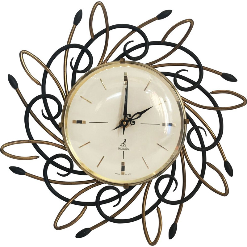 Vintage swiss Sunburst clock in iron and brass 1960