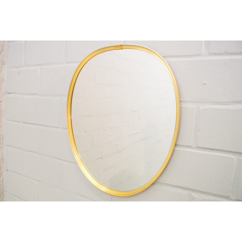 Vintage mirror in golden brass