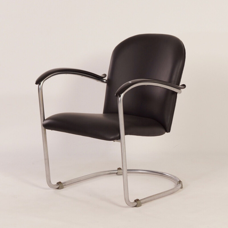 Vintage armchair in plywood, chrome tube, bakelite, leather and foam by W.H. Gispen for Gispen