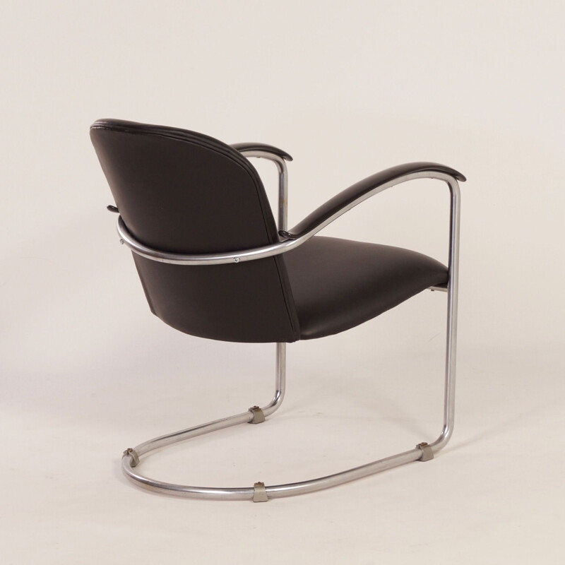 Vintage armchair in plywood, chrome tube, bakelite, leather and foam by W.H. Gispen for Gispen