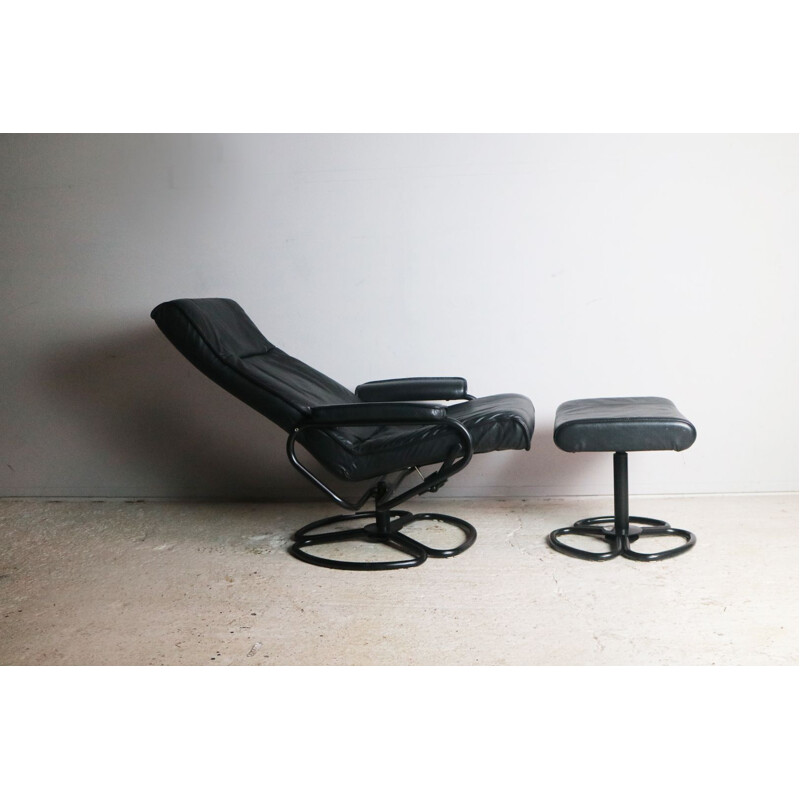 Vintage danish lounge chair and footstool in black leather and steel 1970