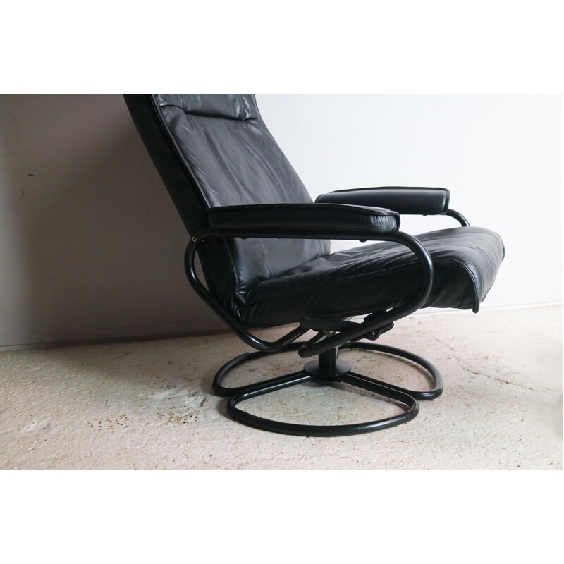 Vintage danish lounge chair and footstool in black leather and steel 1970