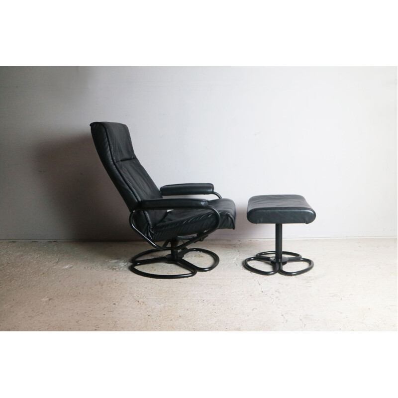 Vintage danish lounge chair and footstool in black leather and steel 1970