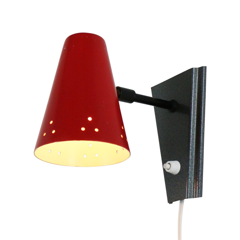 Vintage wall lamp with perforated red shade