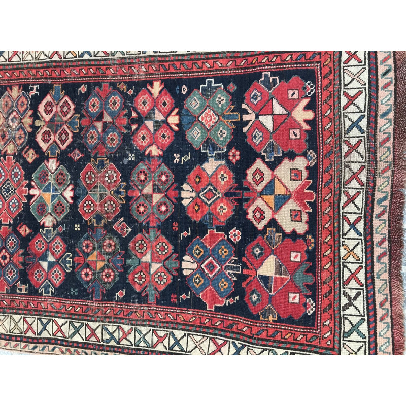 Vintage caucasian rug in wool with geometric patterns