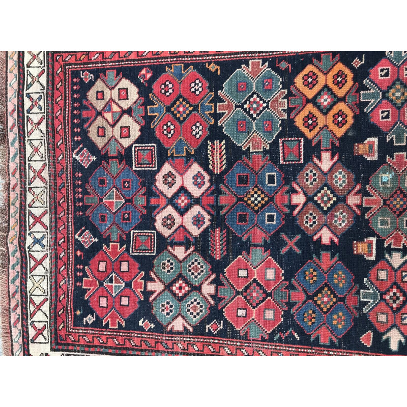Vintage caucasian rug in wool with geometric patterns