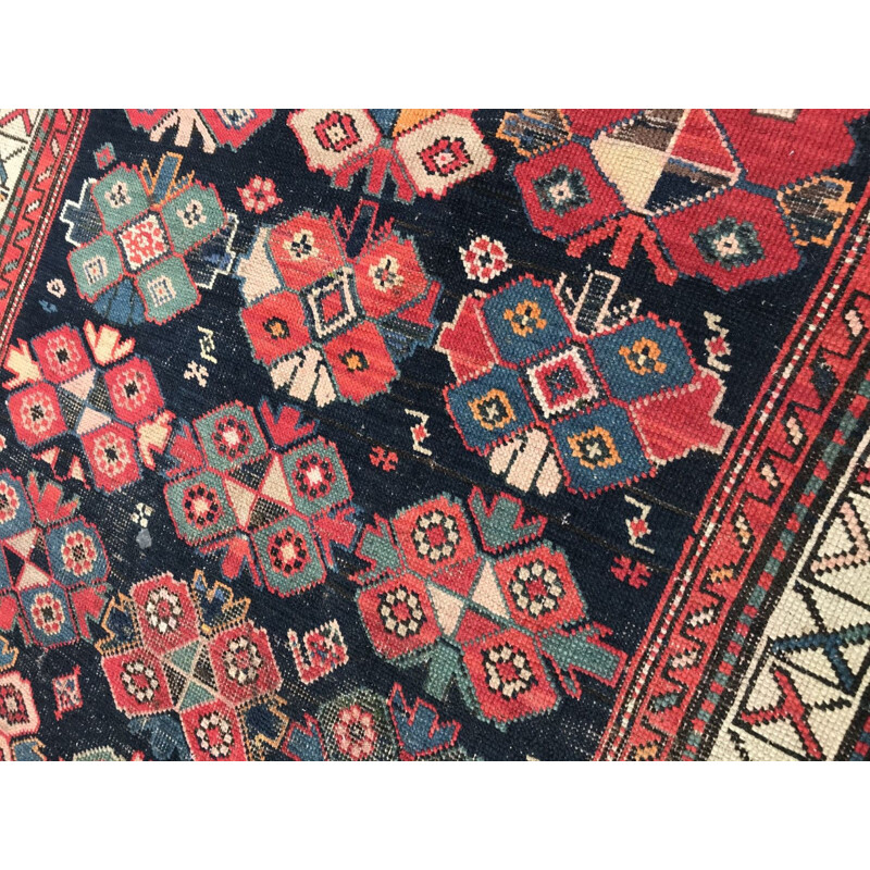 Vintage caucasian rug in wool with geometric patterns