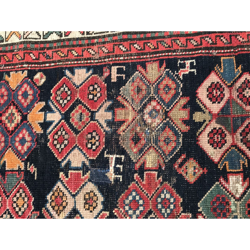 Vintage caucasian rug in wool with geometric patterns