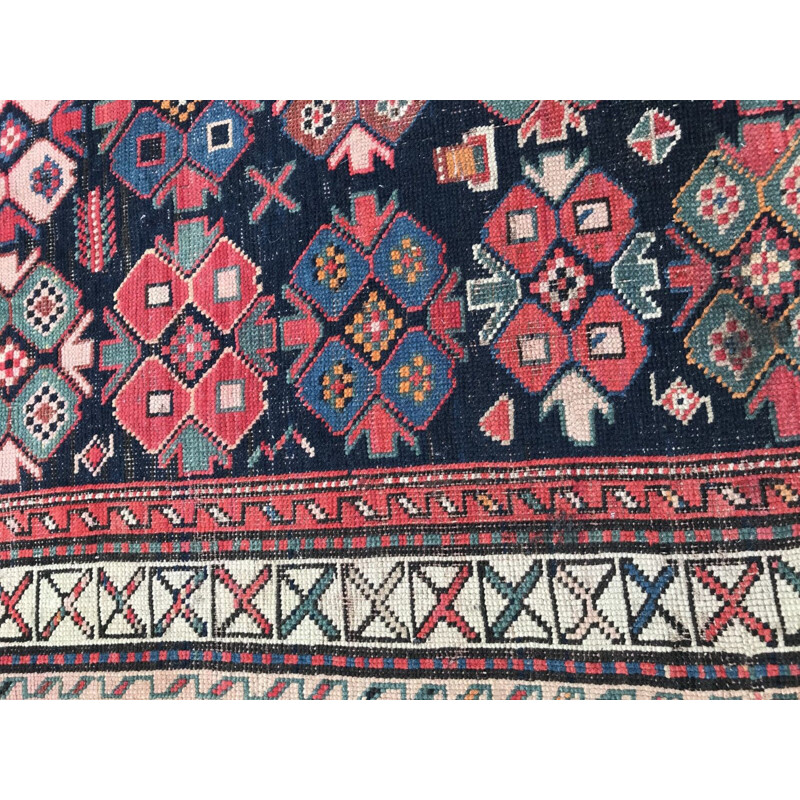 Vintage caucasian rug in wool with geometric patterns