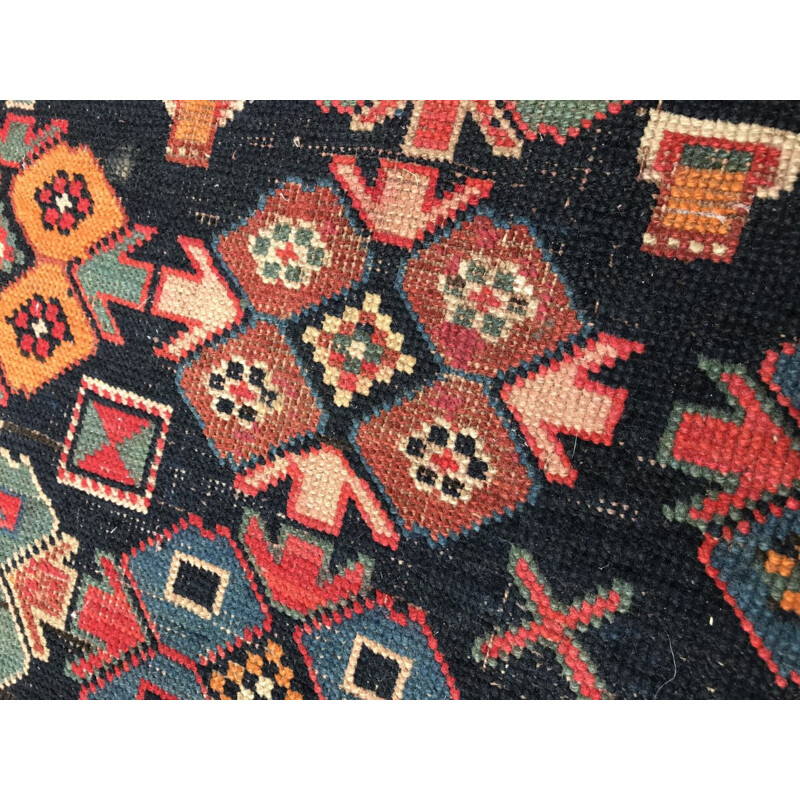 Vintage caucasian rug in wool with geometric patterns