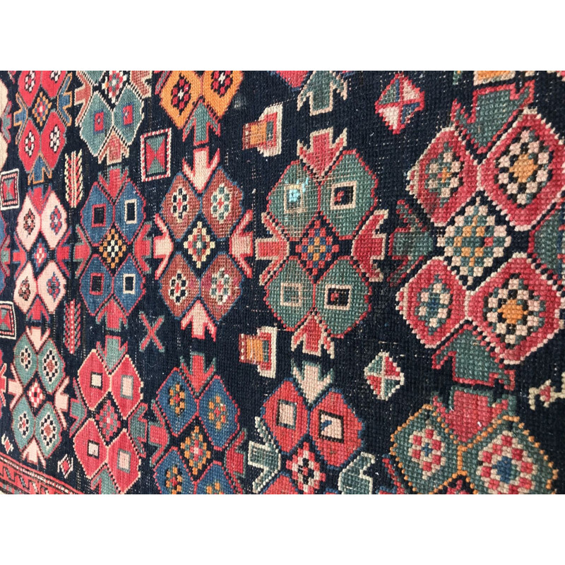 Vintage caucasian rug in wool with geometric patterns