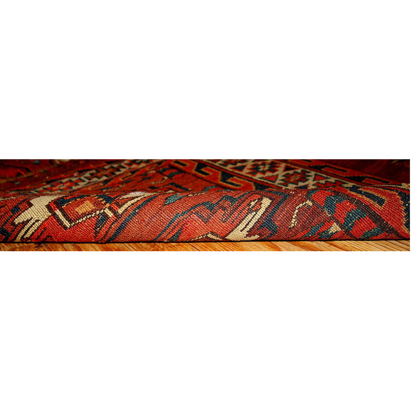 Vintage handmade Turkmen Yomud rug in red wool