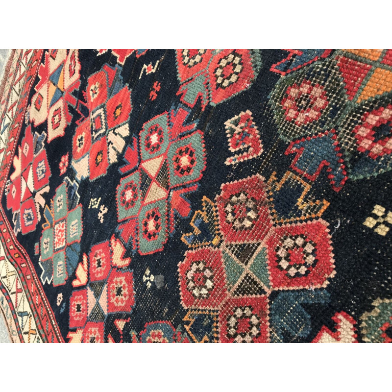 Vintage caucasian rug in wool with geometric patterns