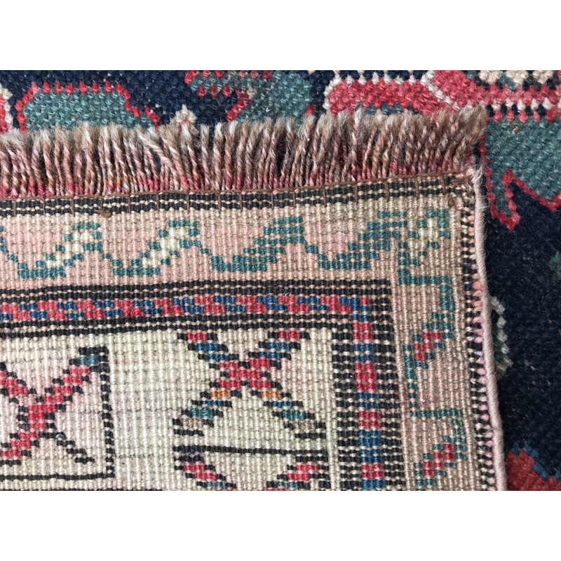 Vintage caucasian rug in wool with geometric patterns