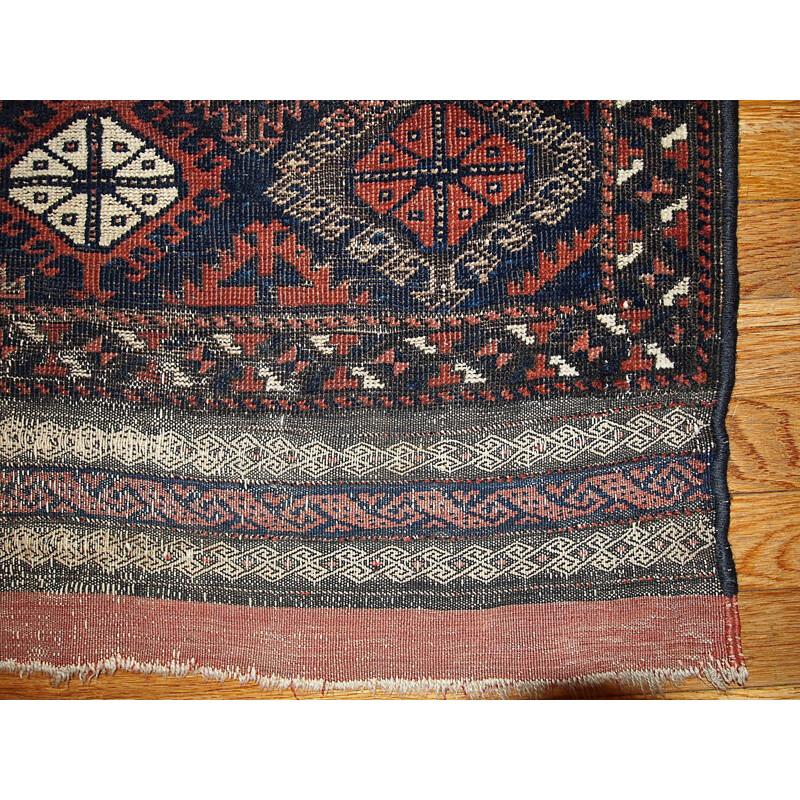 Vintage handmade Afghan Baluch rug in red wool 1930