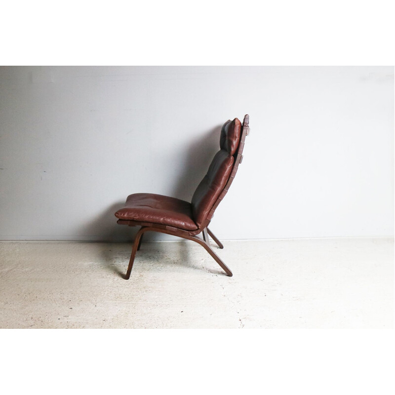Vintage danish brown leather lounge chair in beechwood 1970