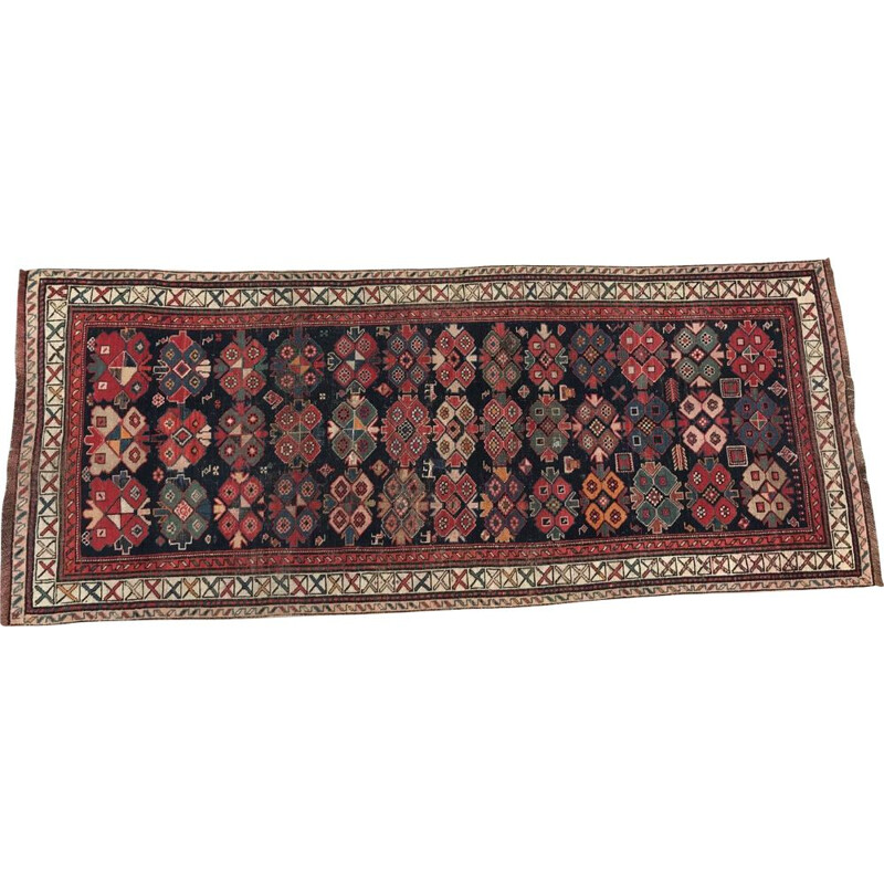 Vintage caucasian rug in wool with geometric patterns